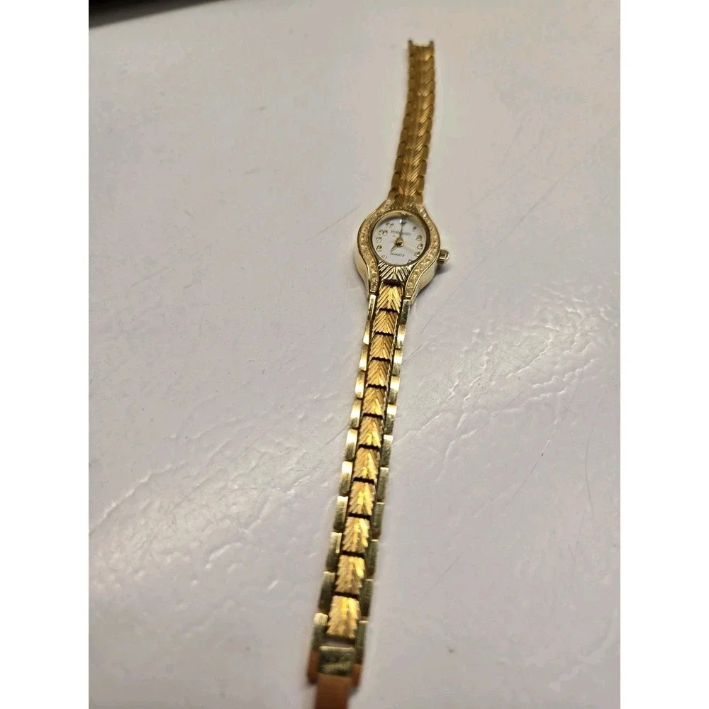 Embassy Womens Watch Gold Tone Rhinestone Bezel Small Chevron Link Bracelet